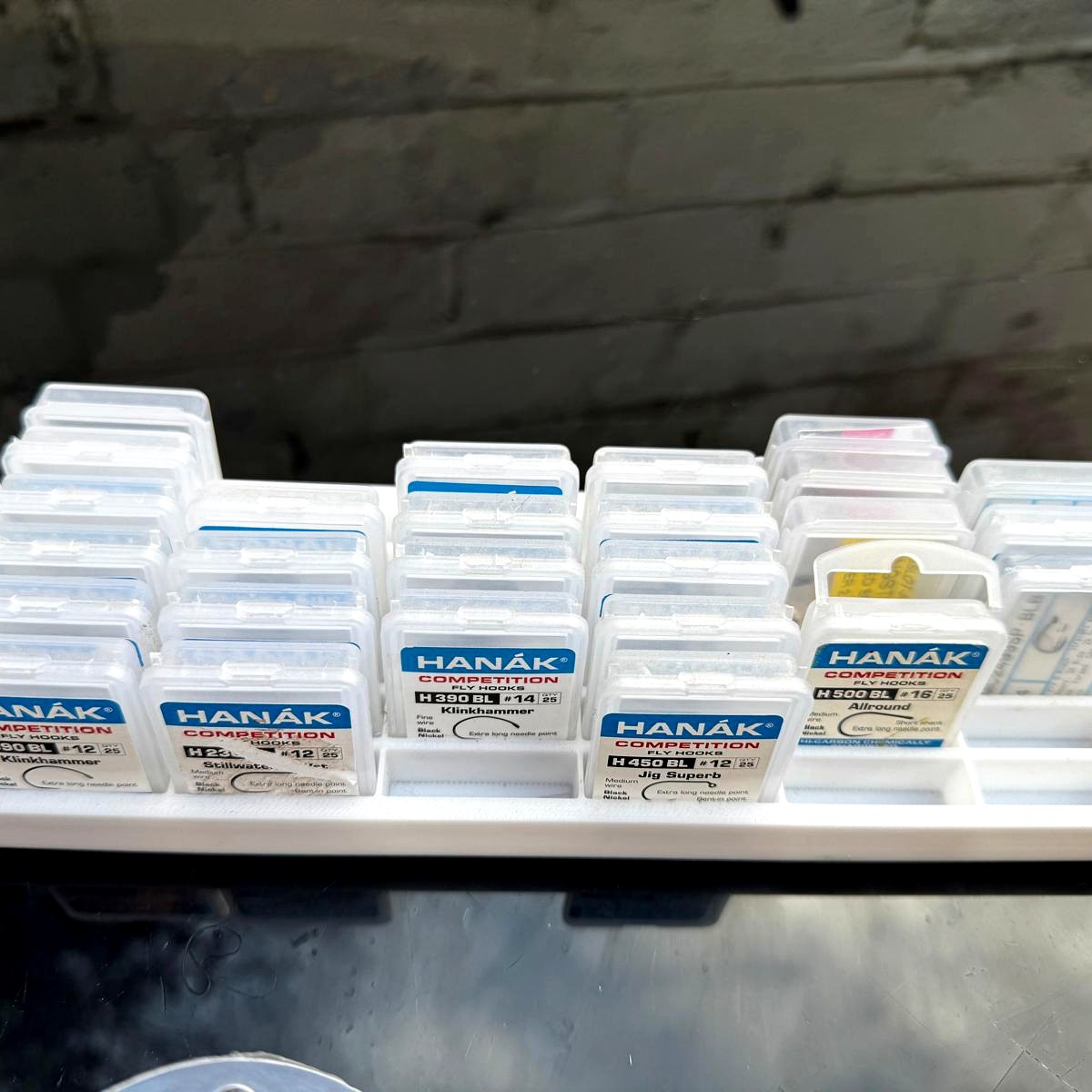 Tray filled with a full set of Hanak Competition hook boxes